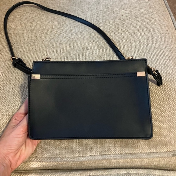 a new day Handbags - Black leather crossbody bag with gold chain accent